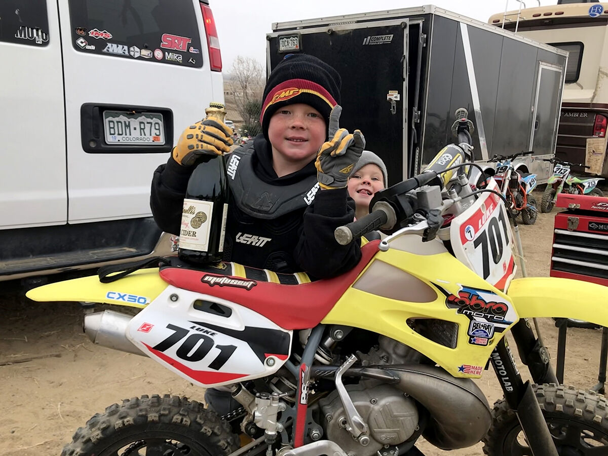 Noah Luke with champagne bottle